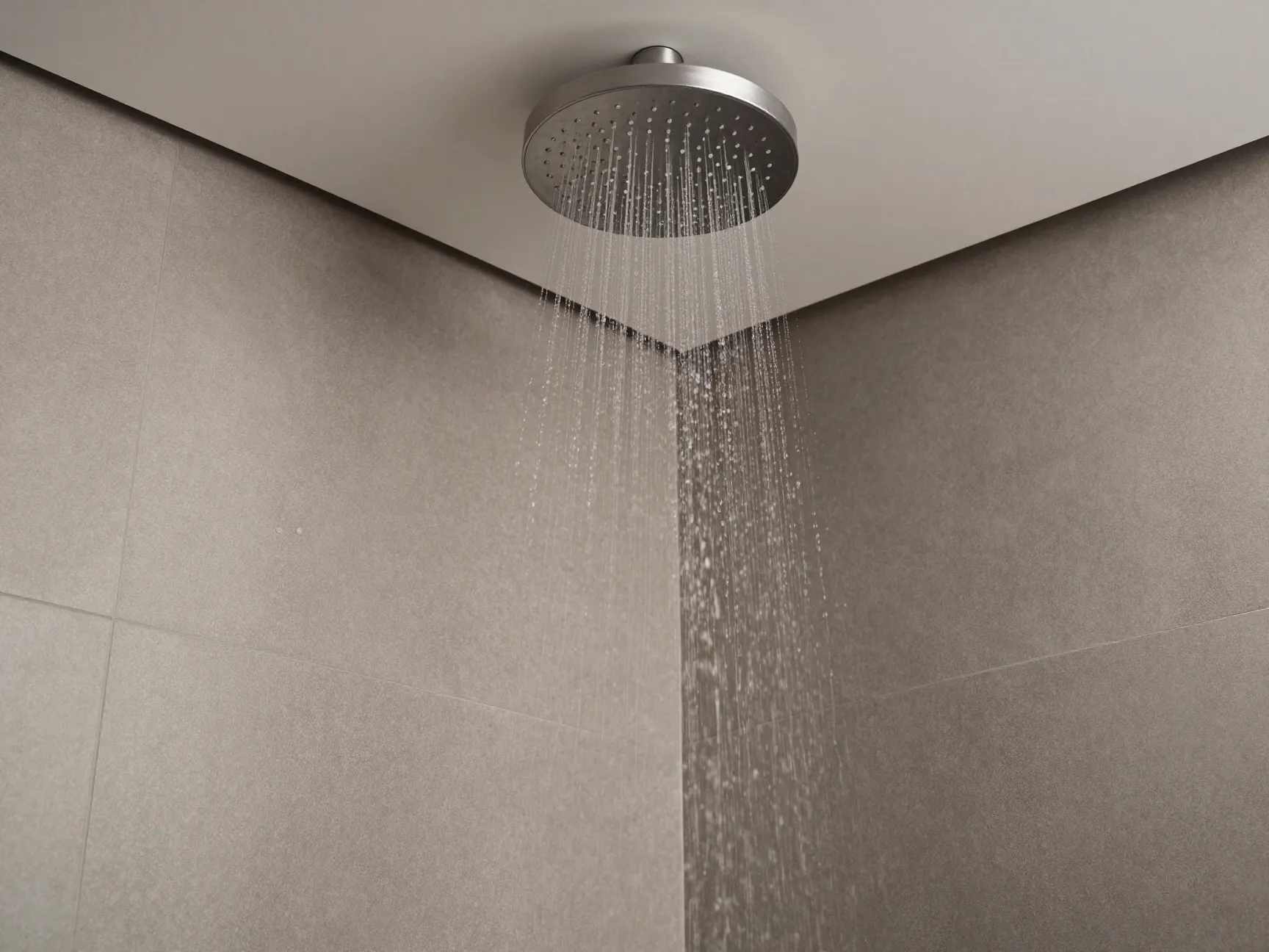5 ceiling mounted rainfall showers paired with seamless wall tiles