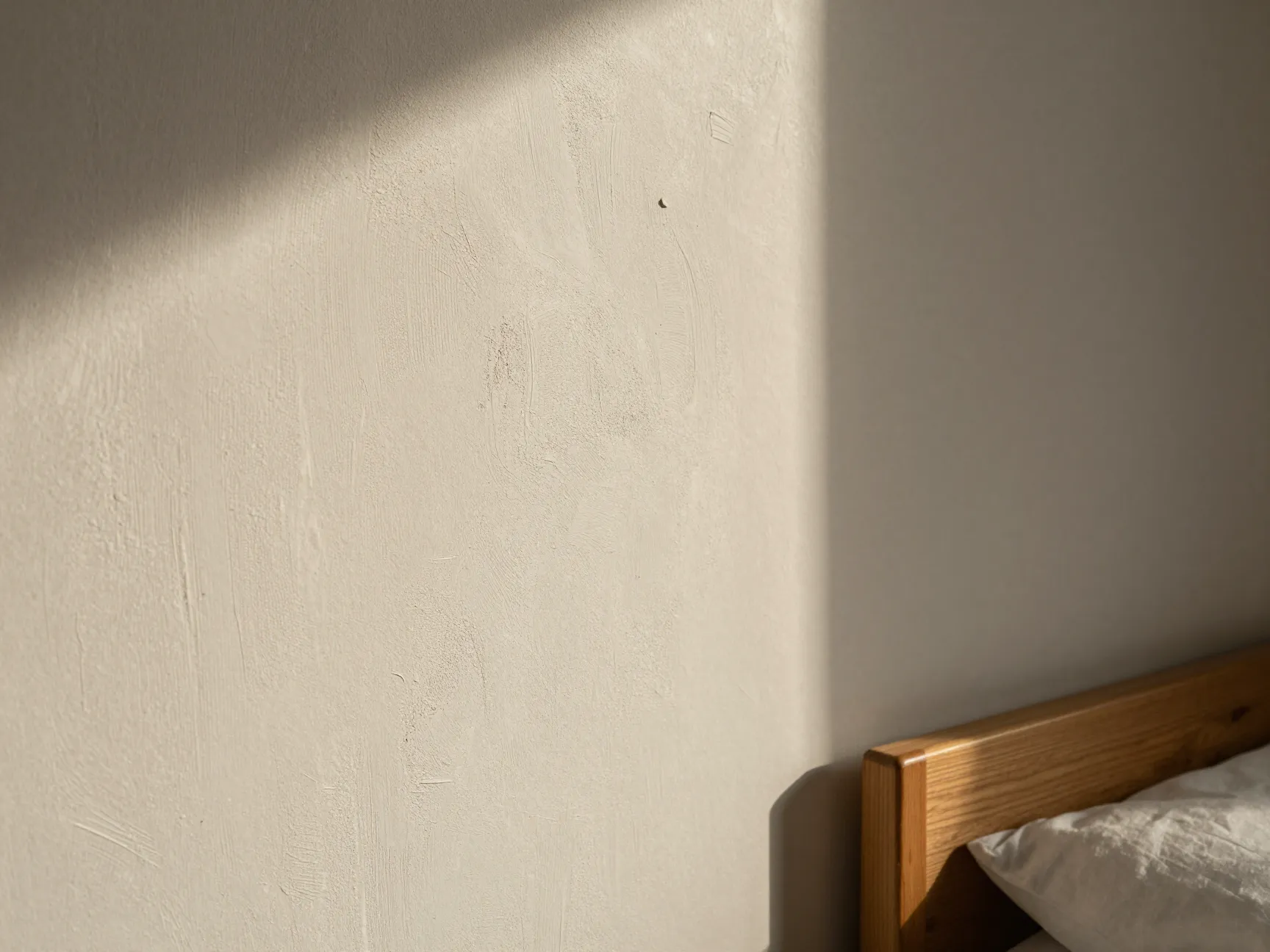 Limewash and textured plaster finishes walls that breathe