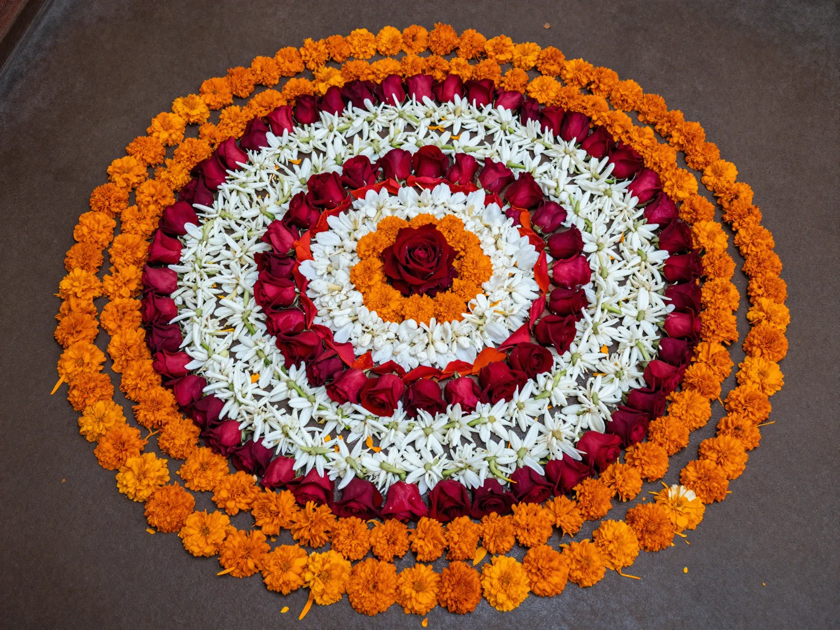 Flower rangoli around the pooja area