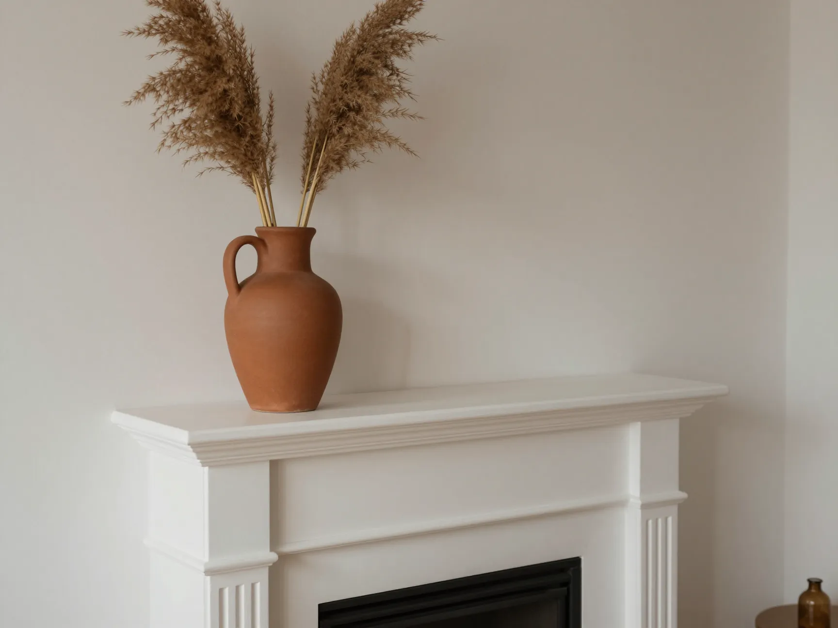 Anchor your mantel with a tall statement vase