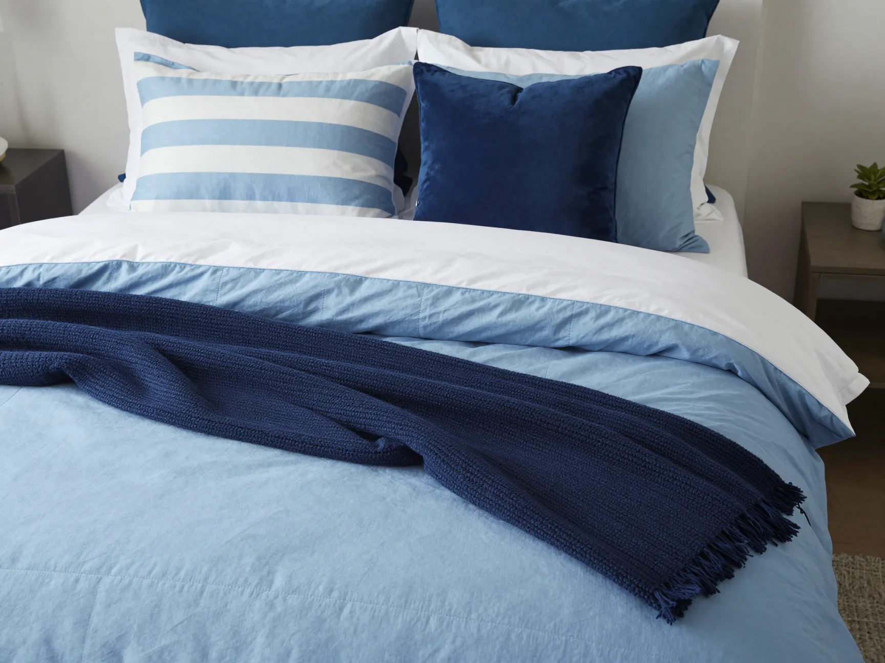 Coastal bedding and textiles layering for comfort and style